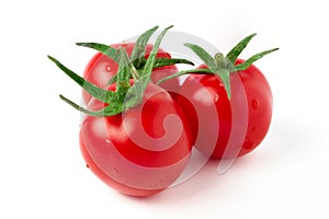 Three ripe red cherry tomatoes with green stalks isolated on white