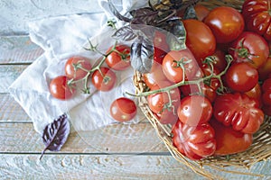 Ripe red cherry tomatoes in a wicker basket