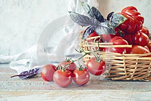 Ripe red cherry tomatoes in a wicker basket