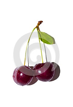 Ripe red cherry on a white isolated background, close-up.