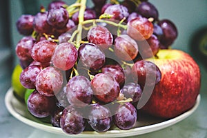 Ripe red grape with apple, closeup, isolated on white background