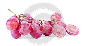 Ripe red grape. Pink bunch with leaves isolated on white. With clipping path. Full depth of field