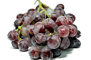 Ripe red grape with water drops, closeup, isolated on white background
