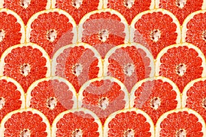Ripe red grapefruit slice pattern, texture background