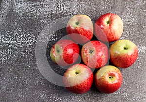 Ripe red green apples on a dark background
