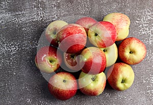 Ripe red green apples on a dark background