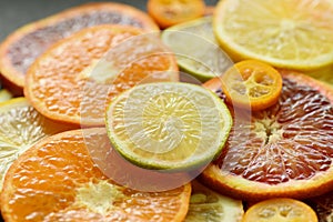 Ripe red orange lemon kumquat lime thin slices