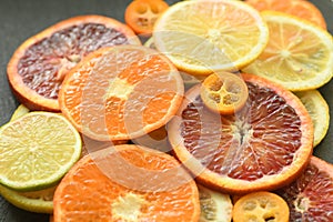 Ripe red orange lemon kumquat lime thin slices