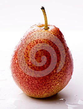 Ripe red pear with water drops