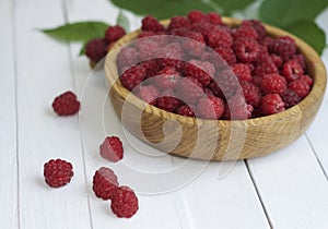 Ripe red raspberries in a bowl