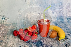 Ripe red strawberries on a blue background