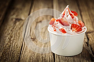 Ripe red strawberries and frozen yogurt photo