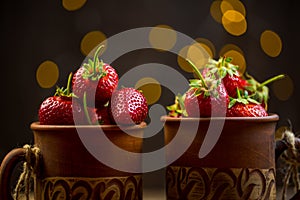 Ripe red strawberries in warm romantic colors with blur background. photo