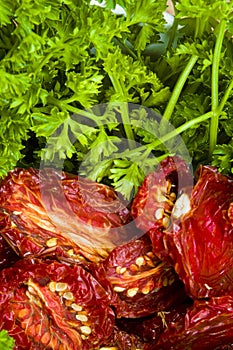 Ripe red sun-dried tomatoes with parsley