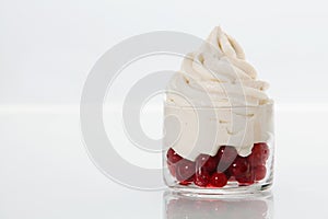 Ripe redcurrants topped with vanilla frozen yogurt photo