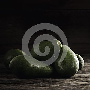 Ripe shiny avocados in heap