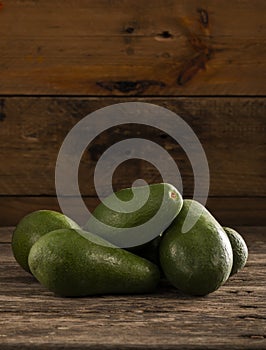 Ripe shiny avocados in heap