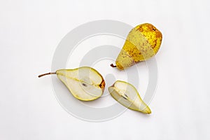 Ripe single pear. Fresh whole fruit, half sliced, seeds. Isolated on white background