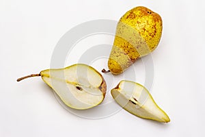 Ripe single pear. Fresh whole fruit, half sliced, seeds. Isolated on white background