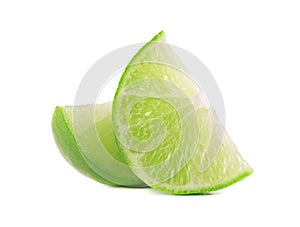 Ripe slice of green lime citrus fruit, isolated on white background. Lime wedge with clipping path