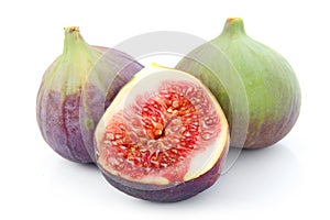 Ripe sliced purple and green fig fruit isolated