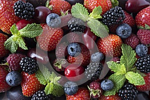 Ripe strawberries, blackberries, blueberries, raspberries, red berries abd plum. Mix berries and fruits.