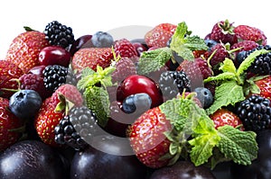 Ripe strawberries, blackberries, blueberries, raspberries, red berries abd plum. Mix berries and fruits. Top view.