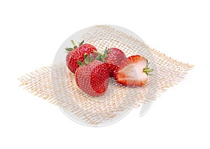 Ripe strawberries from the garden, put on a mat separately on white background