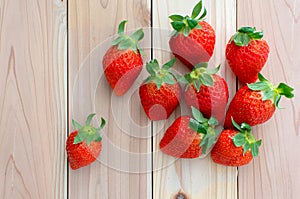 Ripe strawberries over wooden background,copy space ,top view and on people