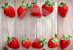 Ripe strawberries over wooden background,copy space ,top view and on people