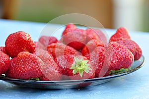 Ripe strawberries on plate