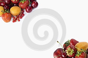 Ripe strawberries, redcurrants, apricots, nectarines and cherries on white background.