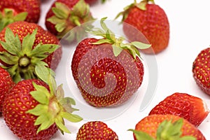 Ripe strawberry on a white background close-up