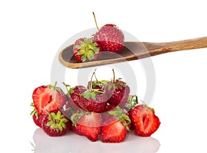 Ripe strawberry in wooden spoon
