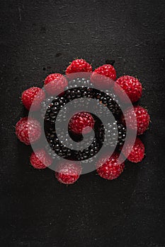 Ripe summer berries raspberries and blackberries