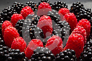 Ripe summer berries raspberries and blackberries