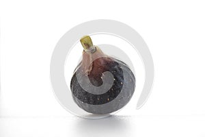 Ripe sweet one fig fruit on white