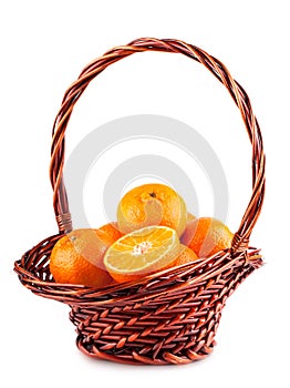 Ripe tangerine in brown basket