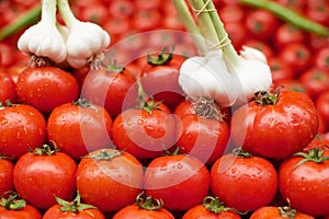 Ripe tomato and garlic for sale
