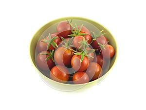 Ripe tomatoes in bowl closeup isolated