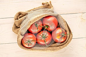 Ripe tomatoes with kitchen utensils isolated on white, black background and top view, macro. photo