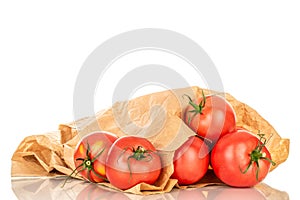 Ripe tomatoes with kitchen utensils isolated on white, black background and top view, macro. photo