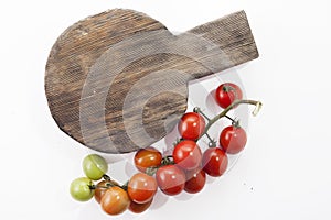 Ripe tomatoes on lie on a cutting board on a white background,,