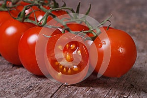 Ripe tomatoes and one sliced ??fruit close up. horizontal