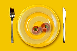 Ripe Tomatoes in yellow plate