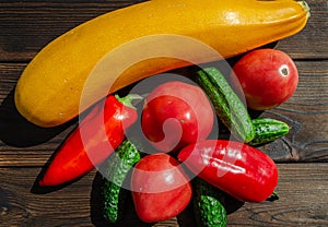 Ripe vegetables on a wooden table close up