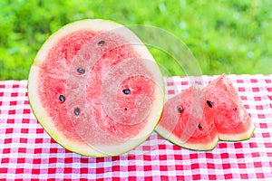 Ripe watermelon isolated on green grass background