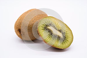 Ripe whole kiwi fruit and half kiwi fruit