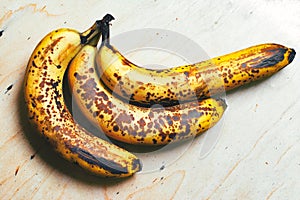Ripe yellow bananas fruits, bunch of ripe bananas with dark spots on a white background with clipping path