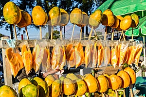 Ripe yellow mangoes on street stall